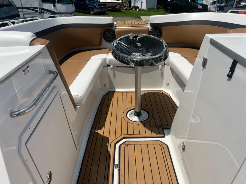 Slide: The Image of 2023 Starcraft SVX 231 OB DH boat interior with teak flooring and seating area. - 34