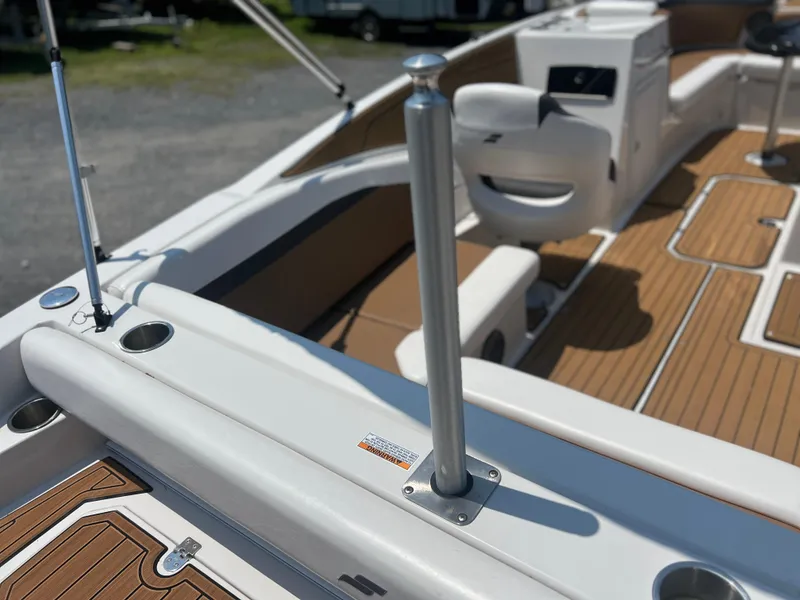 Slide: The Image of 2023 Starcraft SVX 231 OB DH boat interior with teak flooring and seating. - 35