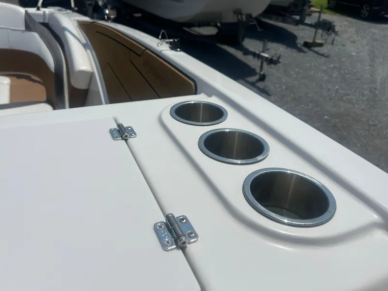 Slide: The Image of 2023 Starcraft SVX 231 OB DH boat interior with cup holders and seating. - 7