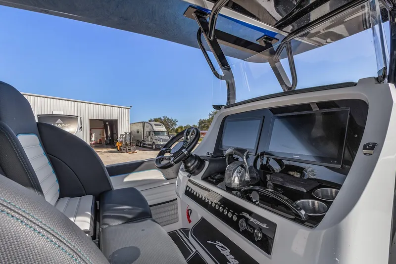 Slide: The Image of 2023 Renegade 38 Open boat cockpit with modern controls and dual screens. - 15