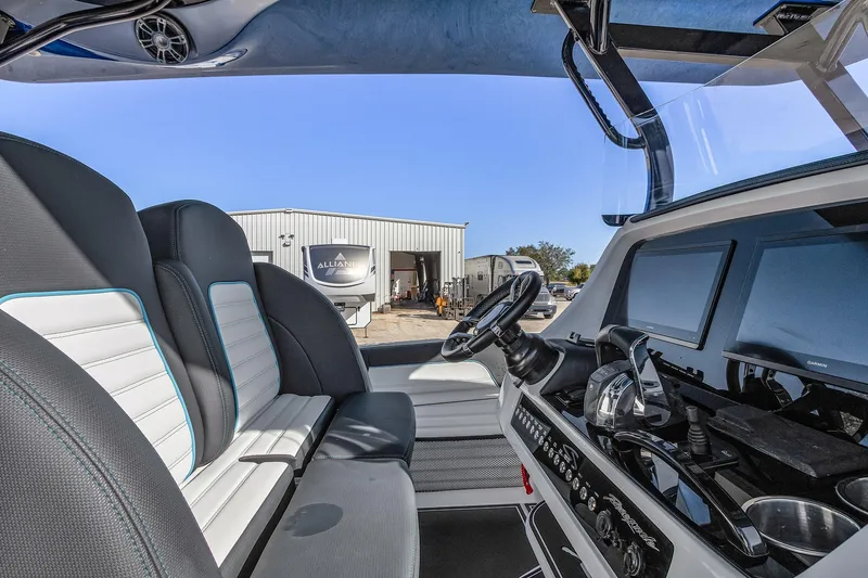 Slide: The Image of 2023 Renegade 38 Open boat interior with modern dashboard and seating. - 17