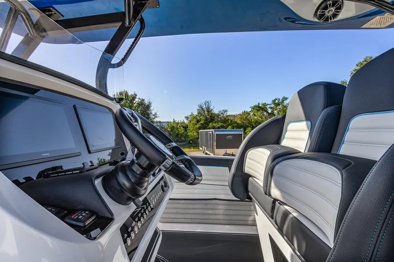 Slide: The Image of 2023 Renegade 38 Open boat interior with modern dashboard and seating. - 20