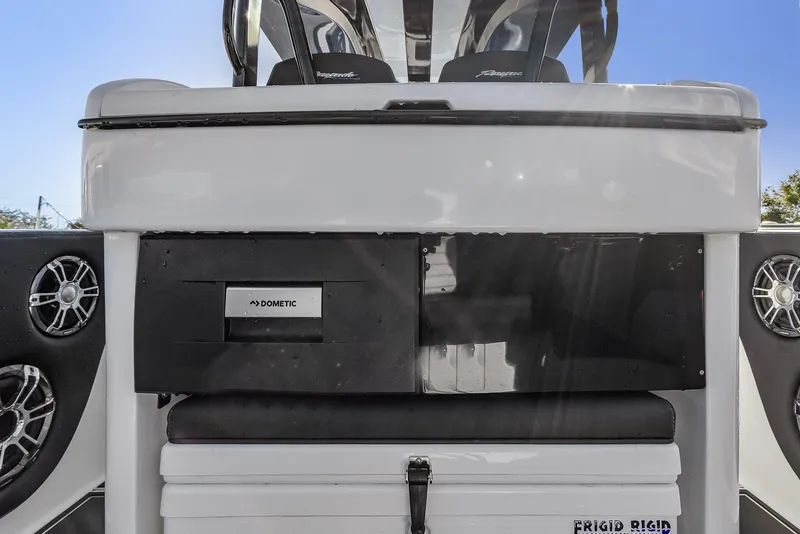 Slide: The Image of 2023 Renegade 38 Open boat interior with Dometic fridge and speakers. - 24