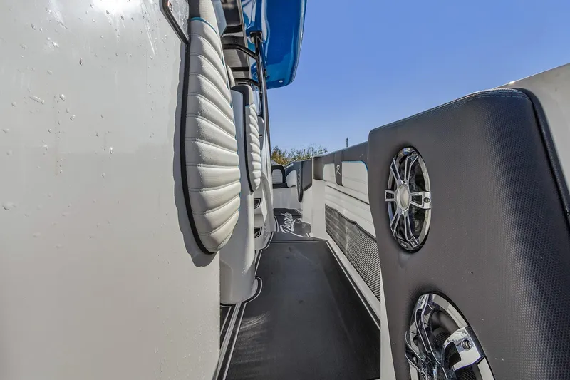 Slide: The Image of 2023 Renegade 38 Open boat deck with speakers and blue canopy. - 27