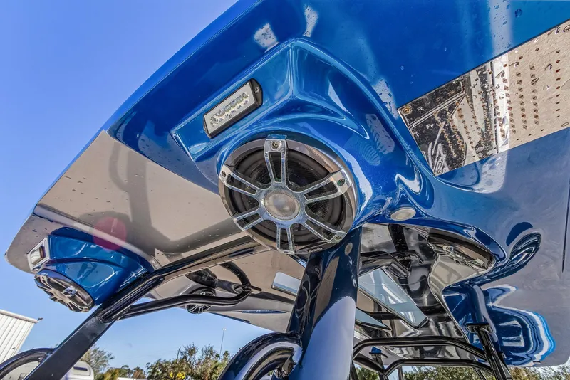 Slide: The Image of Close-up of 2023 Renegade 38 Open boat's blue audio system and canopy. - 29