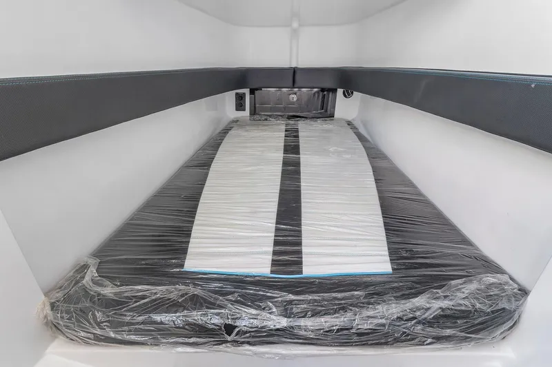 Slide: The Image of Interior cabin of 2023 Renegade 38 Open boat with wrapped mattress. - 37