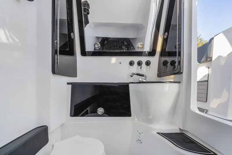 Slide: The Image of 2023 Renegade 38 Open boat interior with modern bathroom fixtures and sleek design. - 38