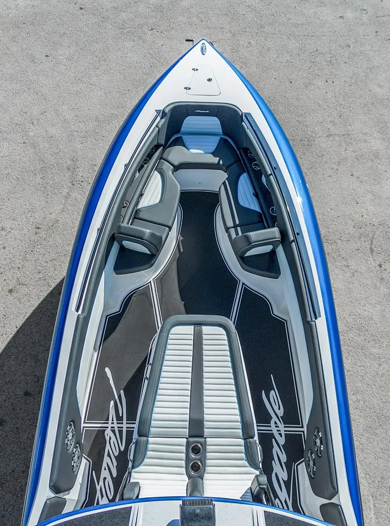 Slide: The Image of 2023 Renegade 38 Open boat, top view, sleek design, blue and white color scheme. - 40