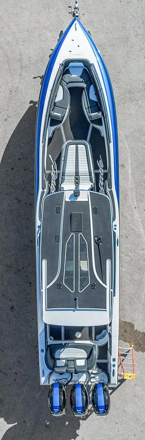 Slide: The Image of Aerial view of 2023 Renegade 38 Open boat with sleek design and triple engines. - 41