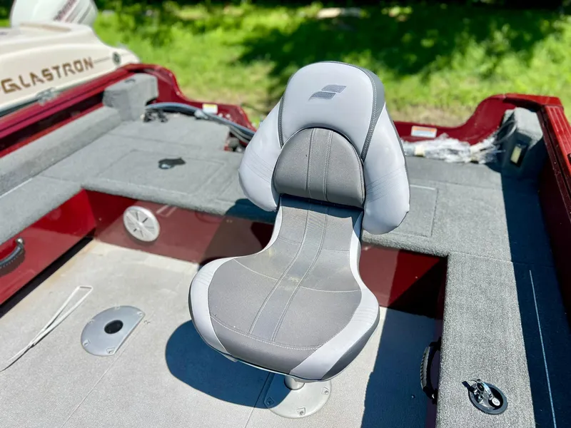 Slide: The Image of 2023 Starcraft Storm 166 SC boat interior with a gray swivel seat. - 14