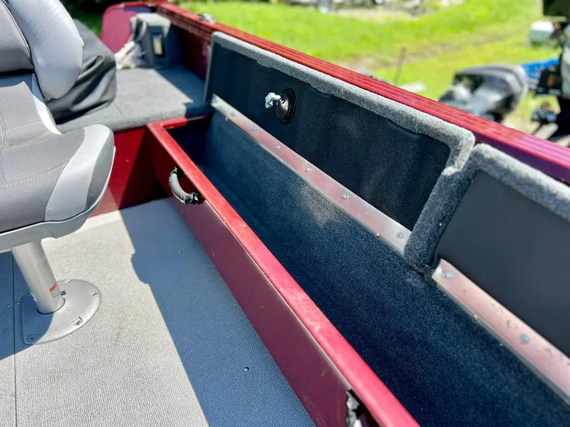 Slide: The Image of 2023 Starcraft Storm 166 SC boat interior with seating and storage compartments. - 15