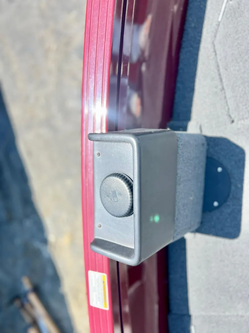 Slide: The Image of Close-up of a 2023 Starcraft Storm 166 SC boat component with a red trim. - 18