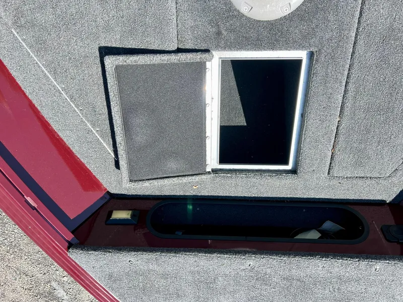 Slide: The Image of 2023 Starcraft Storm 166 SC boat storage compartment with open hatch. - 20