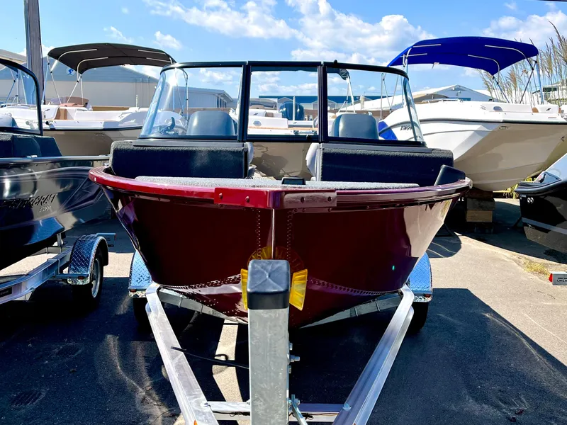 Slide: The Image of 2023 Starcraft Storm 166 DC boat on trailer, front view, sunny day. - 3