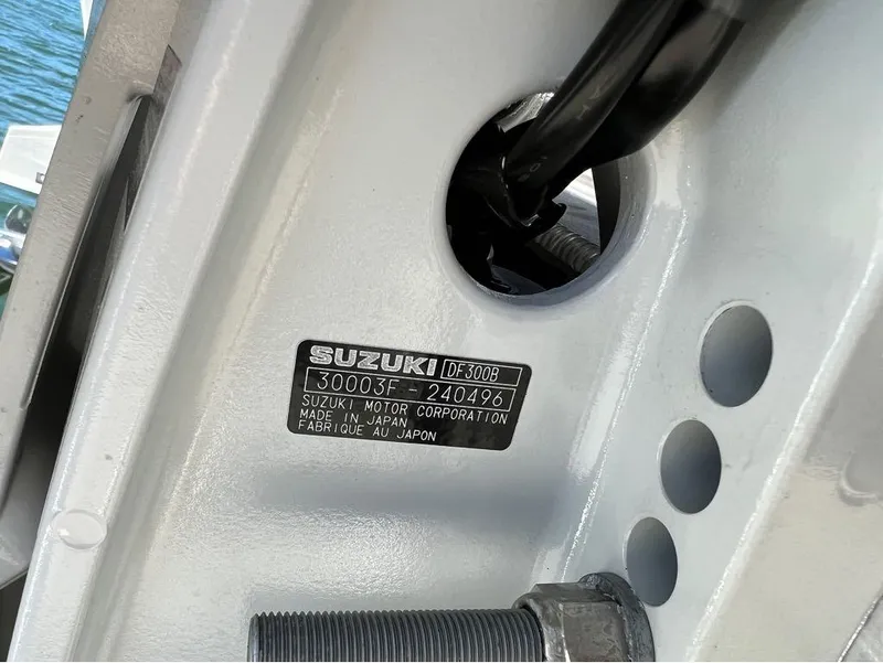 Slide: The Image of Close-up of Suzuki motor label on 2023 Manitou LX 25 SRW boat. - 15