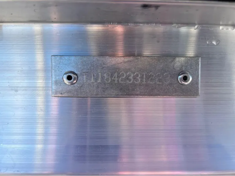Slide: The Image of 2023 Manitou LX 25 SRW metal identification plate with engraved serial number. - 23