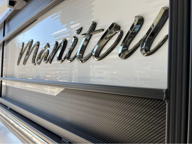 Slide: The Image of 2023 Manitou LX 25 SRW logo on sleek exterior design. - 39