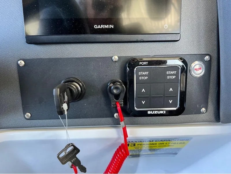 Slide: The Image of Control panel of 2023 Manitou LX 25 SRW with Suzuki start-stop system and Garmin display. - 7