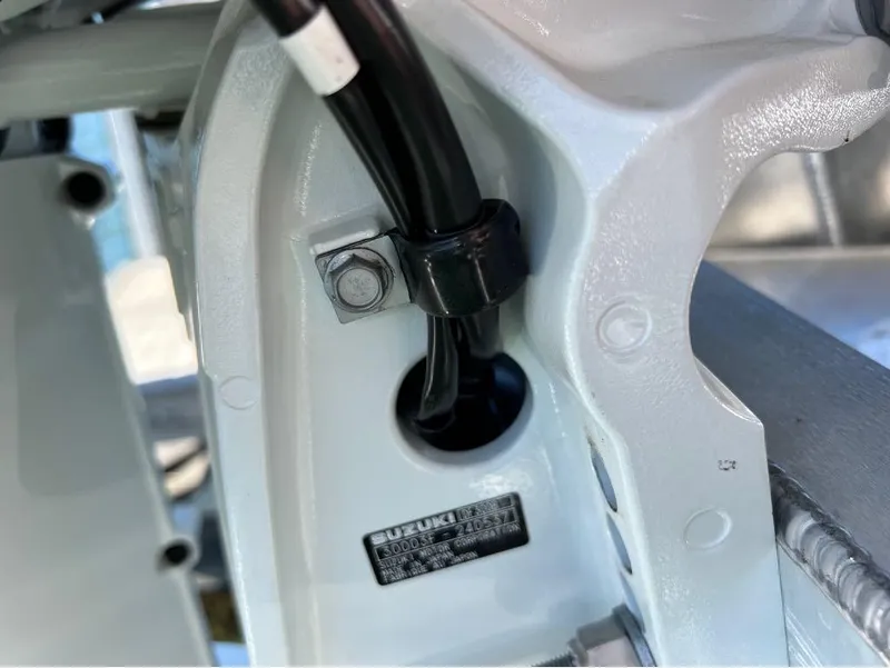 Slide: The Image of Close-up of 2023 Manitou LX 25 SRW component with Suzuki label and wiring detail. - 8