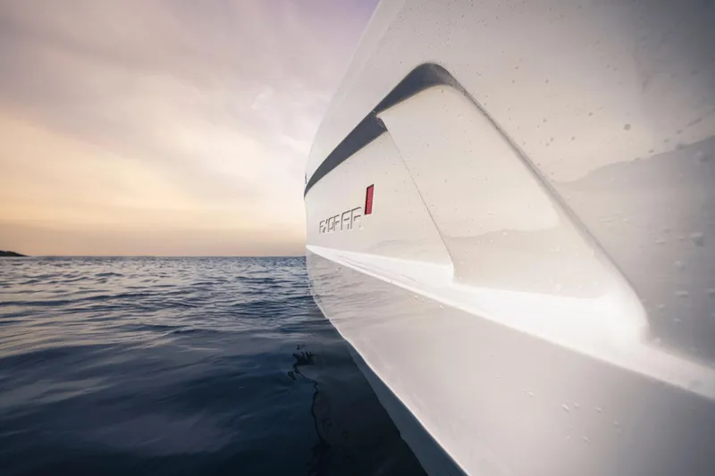 Slide: The Image of 2022 Axopar 22 T-Top x Jobe Revolve boat storage compartment with open lid. - 13