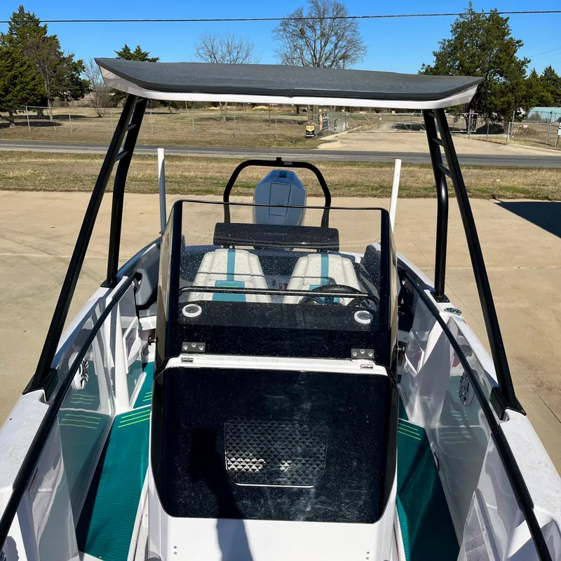 Slide: The Image of 2022 Axopar 22 T-Top x Jobe Revolve boat, interior view in showroom. - 7