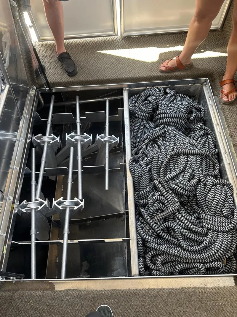 Slide: The Image of Storage compartment with ropes and metal bars on Adonia Meticulous Share #7, 2023 model. - 10