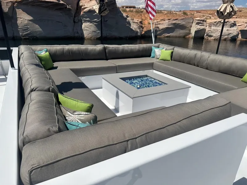Slide: The Image of Luxurious outdoor seating on Adonia Meticulous Share #7, featuring a central fire pit. - 14