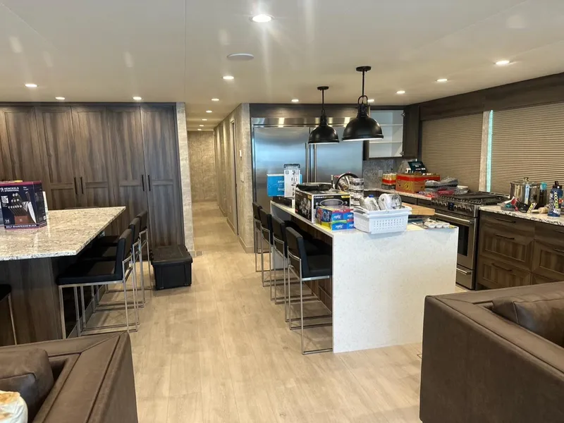 Slide: The Image of Modern kitchen interior in Adonia Meticulous Share #7, 2023, featuring sleek design and ample seating. - 17