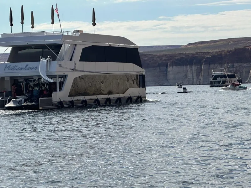 Slide: The Image of Houseboat "Meticulous Share #7" by Adonia on a scenic lake, 2023. - 5