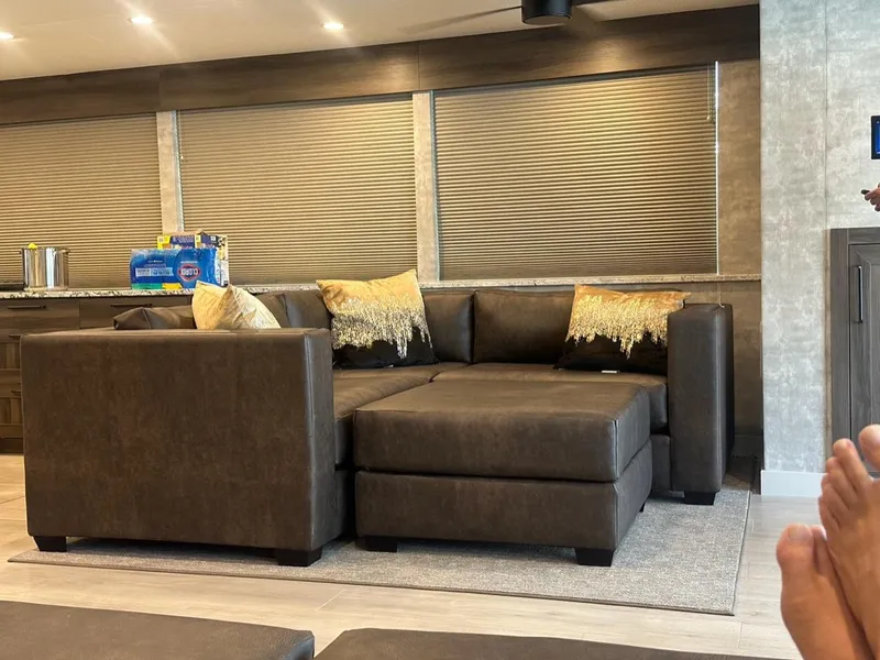 Slide: The Image of Luxurious Adonia Meticulous Share #7 interior with brown sectional sofa, 2023 model. - 8