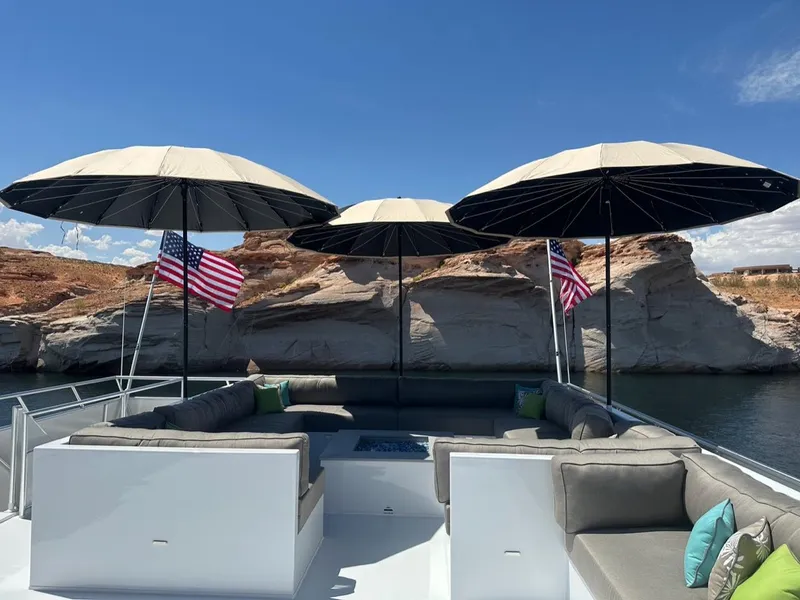 Slide: The Image of Luxurious Adonia Meticulous Share #7 yacht deck with umbrellas and American flags, 2023. - 9