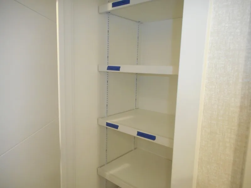 Slide: The Image of Empty white cabinet with adjustable shelves, Adonia Sojourn Trip #9, 2021. - 15