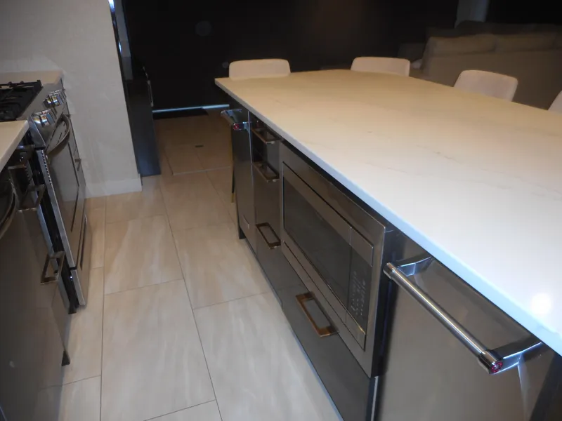 Slide: The Image of Modern kitchen with island and built-in appliances, Adonia Sojourn Trip #9, 2021. - 38