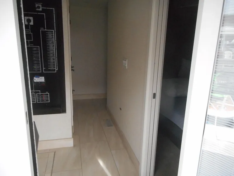 Slide: The Image of Hallway in Adonia Sojourn Trip #9, 2021, with circuit diagram on wall. - 5