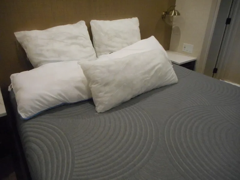 Slide: The Image of Cozy bed with gray blanket and white pillows, Adonia Sojourn Trip #9, 2021. - 9