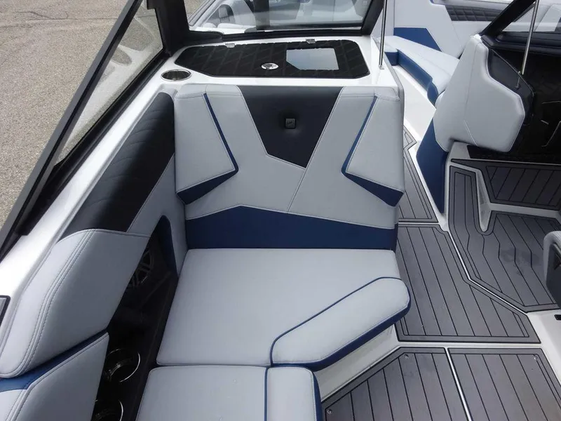 Slide: The Image of 2023 Nautique S23 boat interior with modern seating and sleek design. - 12
