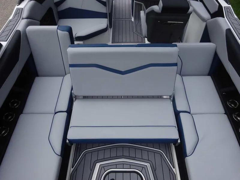 Slide: The Image of 2023 Nautique S23 boat interior with luxurious seating and modern design. - 4