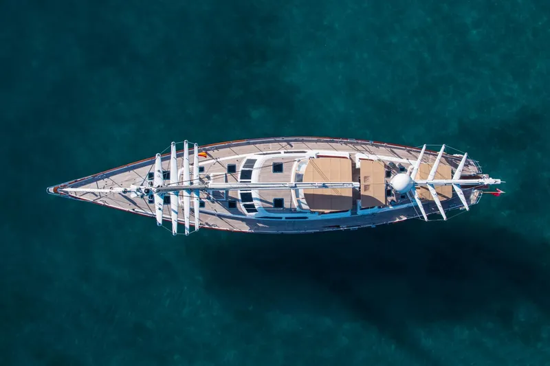 Slide: The Image of Aerial view of a 1998 Alloy Yachts Cruising Ketch on blue water. - 12