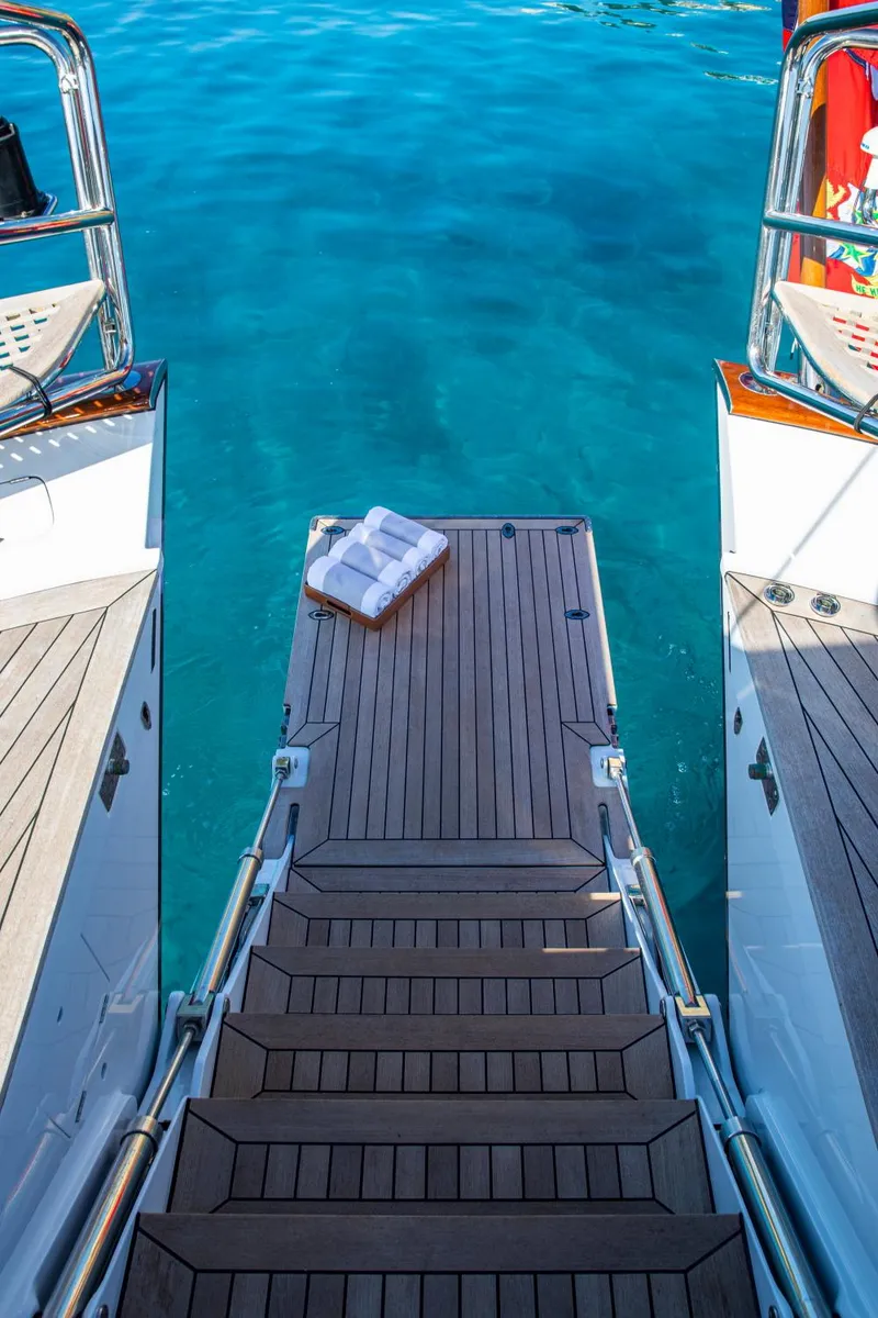 Slide: The Image of Alloy Yachts Cruising Ketch 1998, steps leading to turquoise water. - 15