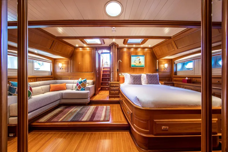 Slide: The Image of Luxurious cabin on Alloy Yachts Cruising Ketch 1998, featuring wood finish and cozy sofa. - 36