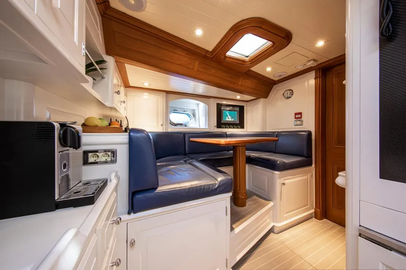Slide: The Image of Interior of a 1998 Alloy Yachts Cruising Ketch with blue seating. - 41