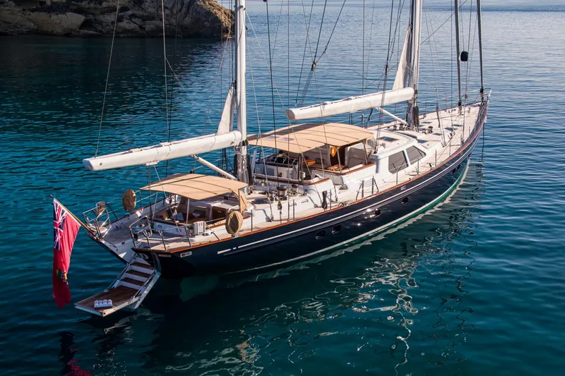 Slide: The Image of Luxury Alloy Yachts Cruising Ketch from 1998 on calm waters. - 8