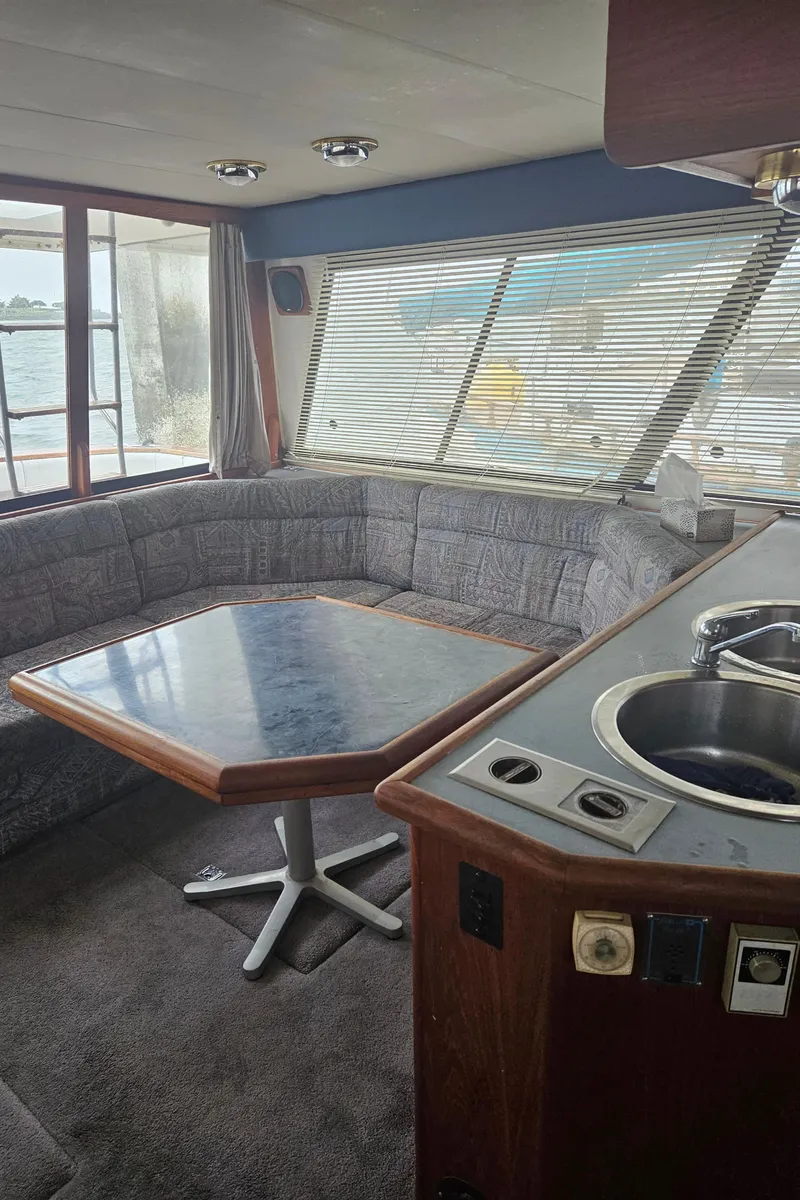 Slide: The Image of Interior of 1992 Bayliner 4588 Pilothouse MY with seating and table. - 14