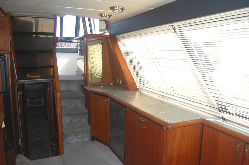 Slide: The Image of Interior of 1992 Bayliner 4588 Pilothouse MY with wooden cabinetry and large windows. - 17