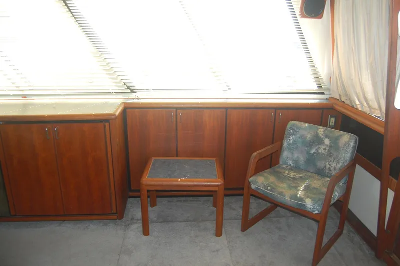 Slide: The Image of Interior of 1992 Bayliner 4588 Pilothouse MY with wooden cabinets and seating. - 19