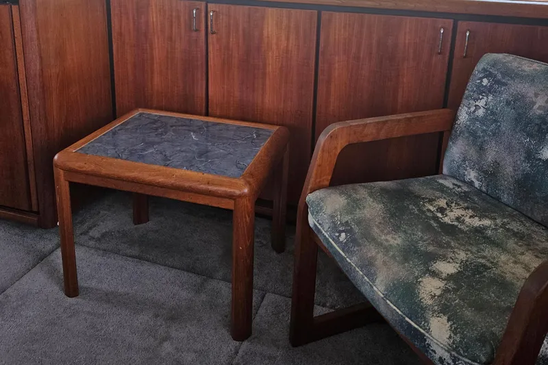 Slide: The Image of Interior of 1992 Bayliner 4588 Pilothouse MY with wooden table and upholstered chair. - 20