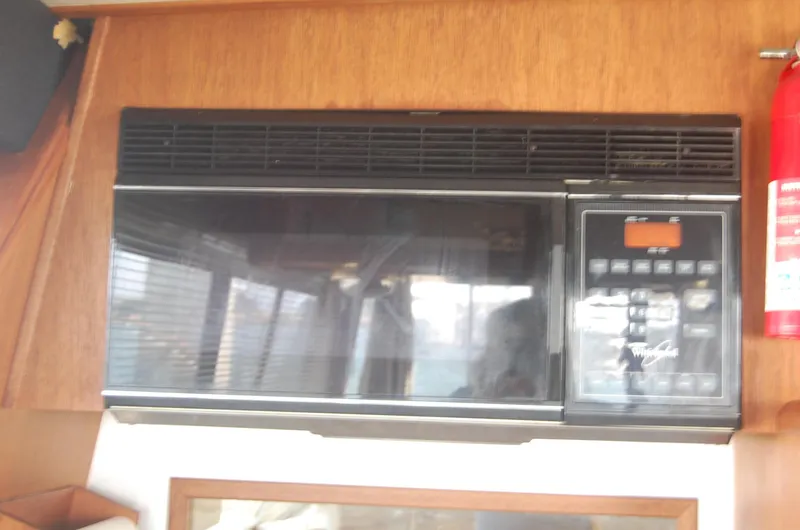 Slide: The Image of Microwave oven inside 1992 Bayliner 4588 Pilothouse MY yacht kitchen area. - 27