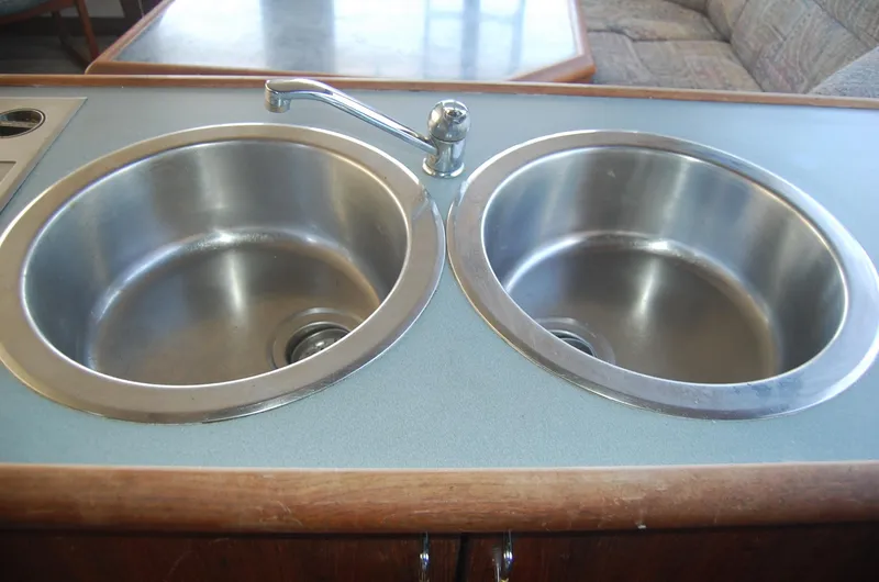 Slide: The Image of Double stainless steel sink in 1992 Bayliner 4588 Pilothouse MY kitchen area. - 28