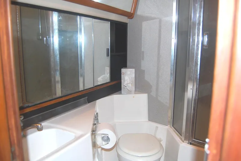 Slide: The Image of Bathroom interior of 1992 Bayliner 4588 Pilothouse MY yacht with mirror and shower. - 34