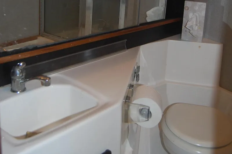 Slide: The Image of Bathroom interior of 1992 Bayliner 4588 Pilothouse MY yacht, featuring sink and toilet. - 37